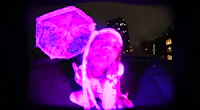 a person holding a purple umbrella