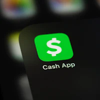 a green cash app icon on a phone screen