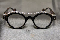 a pair of glasses with chains on them
