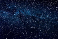 a blue starry sky with a milky in the background
