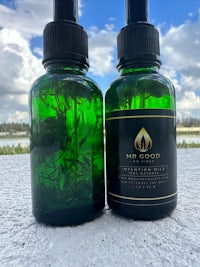 two bottles of cbd oil next to each other