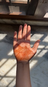 a person's hand with henna on it