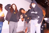 a group of people standing next to each other in a room