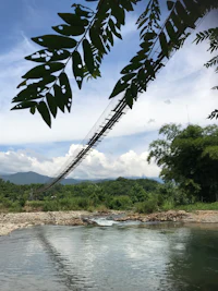 a suspension bridge over a river
