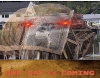 a picture of a bridge with the words our day is coming