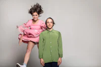 a woman in a pink dress and a man in a blue shirt