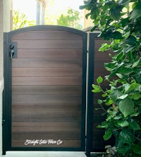 a wooden gate in front of a house
