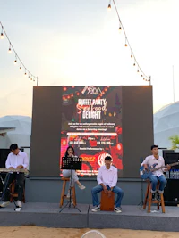 a group of people playing music on a stage