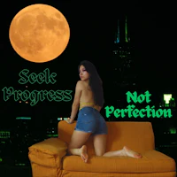 a woman sitting on a couch in front of a full moon
