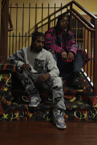 a man and a woman sitting on stairs