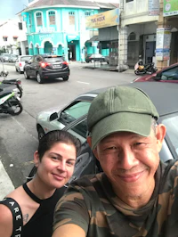 a man and woman taking a selfie on the street