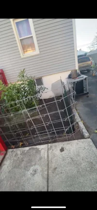 a metal fence in front of a house