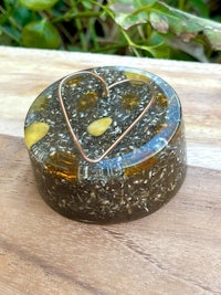 a heart shaped box on a wooden table