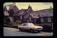 a car is parked in front of a building