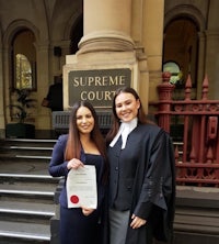 two women standing in front of the supreme court