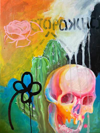 a painting with a skull and cactus