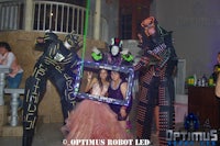 a group of people dressed as robots pose for a picture