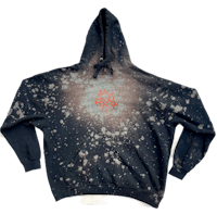 a black hoodie with a white and orange design on it