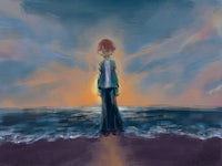 a person standing on a beach looking at the ocean