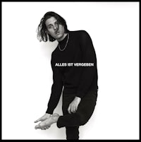 a black and white photo of a man posing for a photo