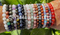 crystal bracelets on a person's wrist