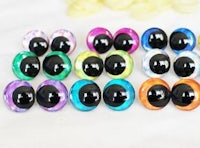 a set of colorful plastic eyeballs on a white table