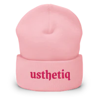 a pink beanie with the word utsethu on it