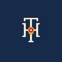 a logo with the letter t on a blue background