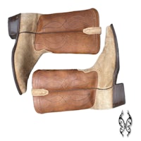 a pair of brown cowboy boots on a white background
