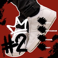 a pair of white sneakers with a crown on them