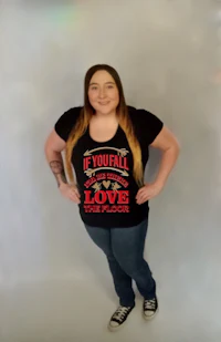 a woman wearing jeans and a black t - shirt