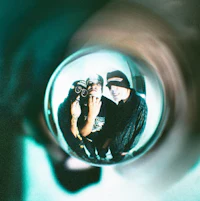 a group of people in a mirror