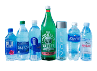 a group of bottles of water on a black background