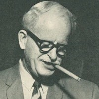 an old black and white photo of a man smoking a cigarette
