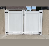 a white gate with the words straight edge co