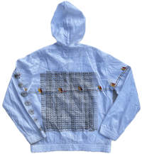 a white jacket with a black and white design on it