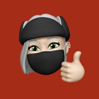 a woman wearing a mask and giving a thumbs up