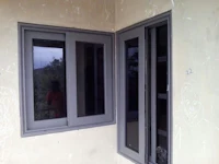 a window in a house with a grey frame