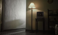 a lamp in the corner of a room