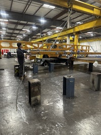 a man is working on a machine in a factory