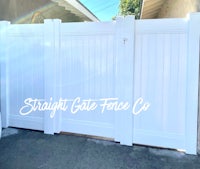 a white gate with the words straight gate co