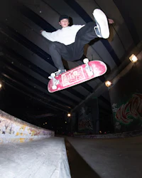 a man doing a trick on a skateboard