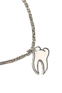 a silver tooth charm on a chain