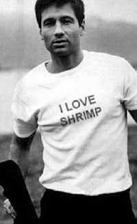 a man wearing a t - shirt that says i love shrimp