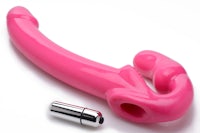 a pink plastic sex toy with a metal tip