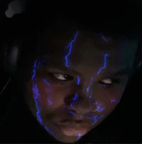 a man with blue lightning on his face