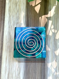 a box with a spiral design on it