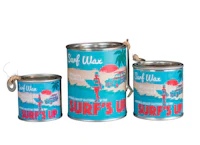 three tins with the words surf's up on them