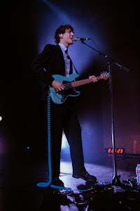 a man playing a guitar