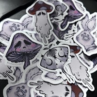 a pile of stickers with different designs on them